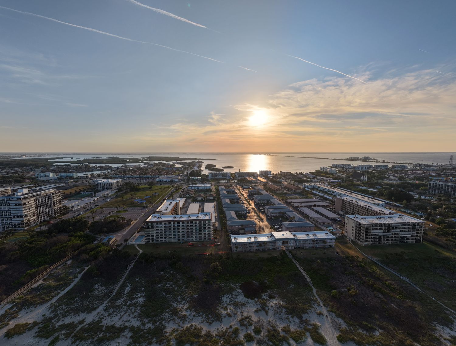 Cocoa Beach from the air at sunset, condos and lagoon